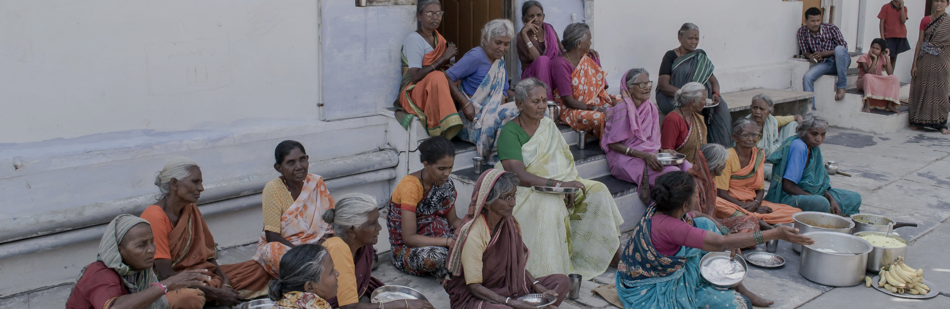 Destitute elderly women receiving midday meals at SERUDS